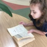 Young student learns to read at Counterpane